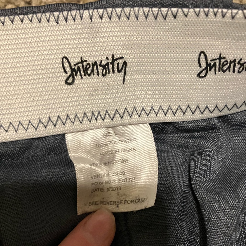 3 pairs of softball pants, Two women’s large, and one women medium.